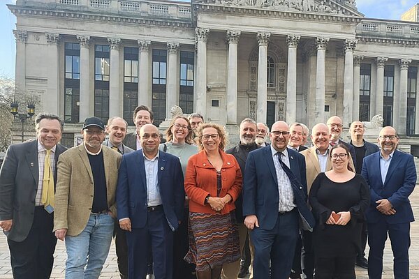 Portsmouth's Liberal Democrat councillors stood in front of Portsmouth Guildhall
